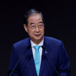 Court reinstates impeached South Korean PM as acting president